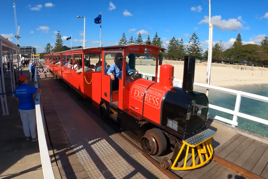 A red train, the Busselton Jetty train, pictured on the jetty at Busselton. 